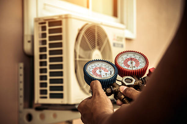 Professional Air Conditioning Service technician working in Taylorsville, IN